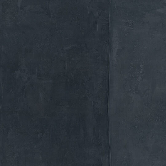 Velar Plain Sea Storm, the colour of the horizon before the weather changes — blue-grey and charged with latent atmosphere. A wall that makes a room feel like it's looking out at something.